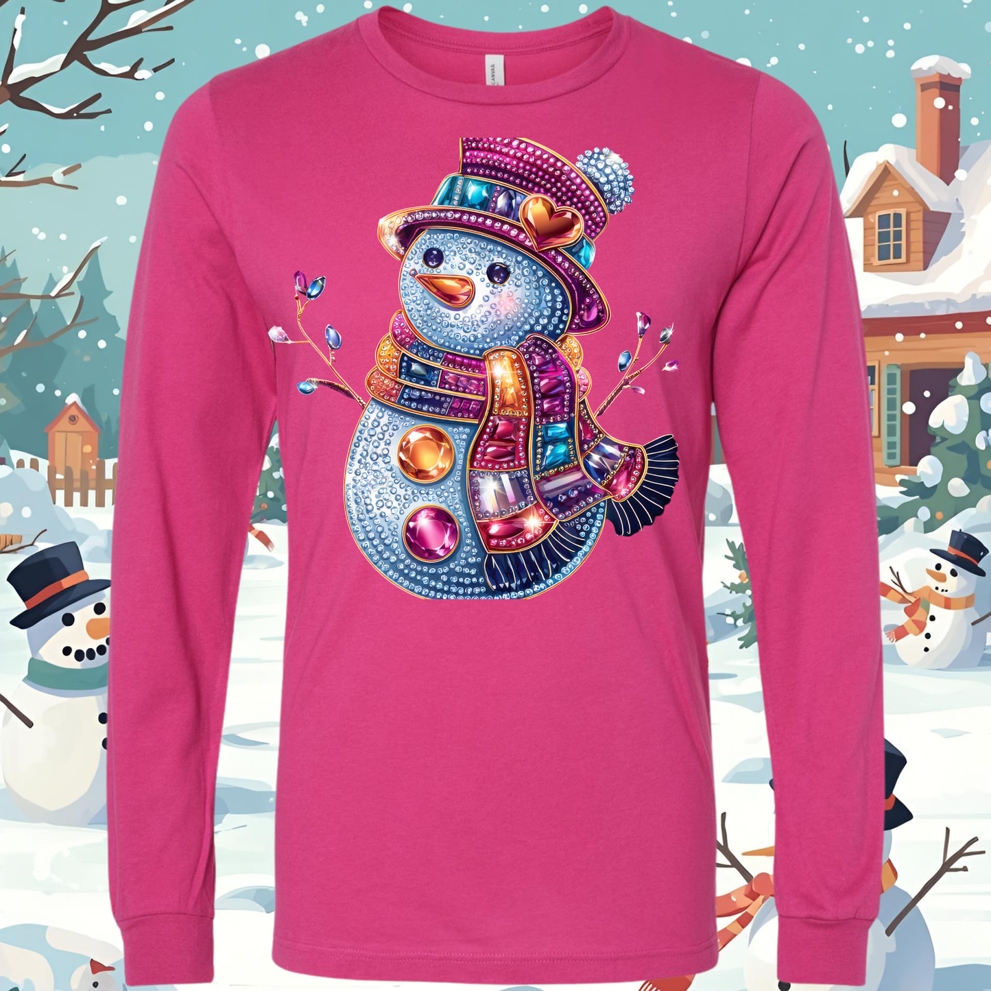 Pink long-sleeve shirt with a colorful snow woman bling design on a snowy background