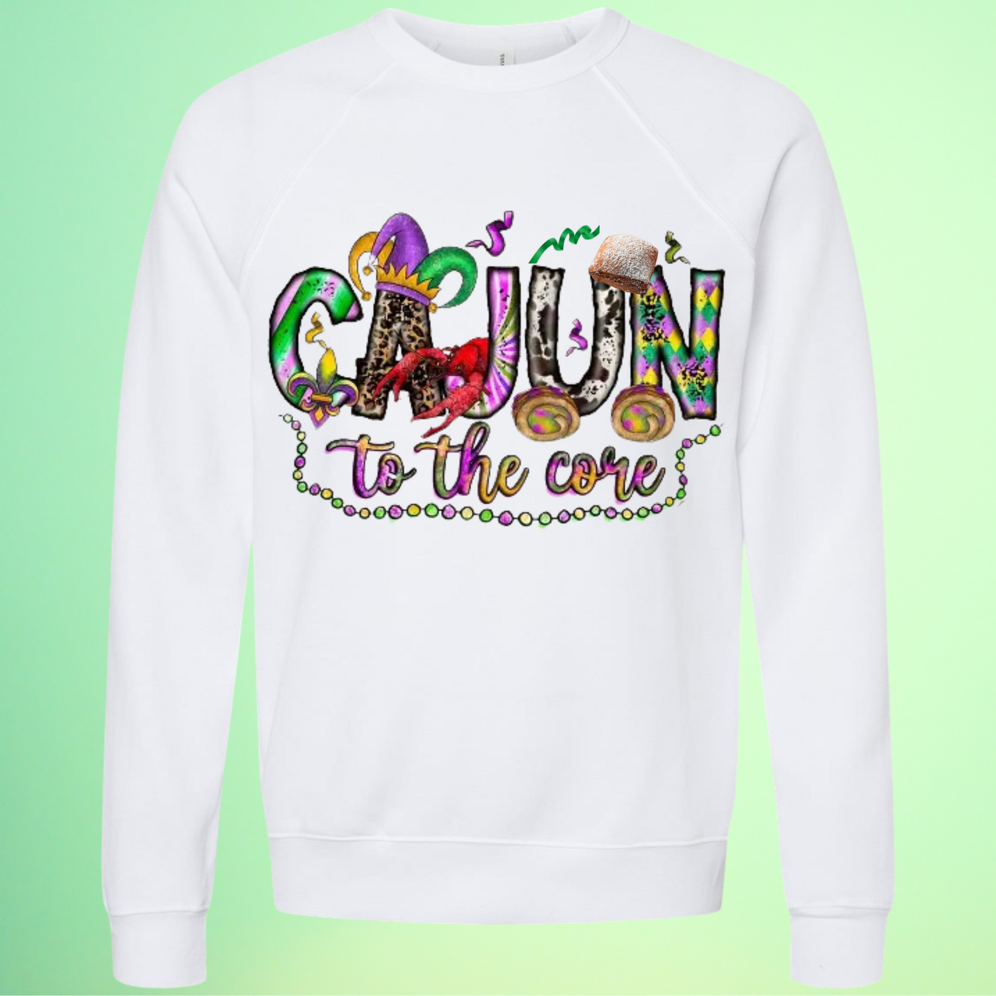 White sweatshirt with colorful 'Cajun to the core' text on a green background