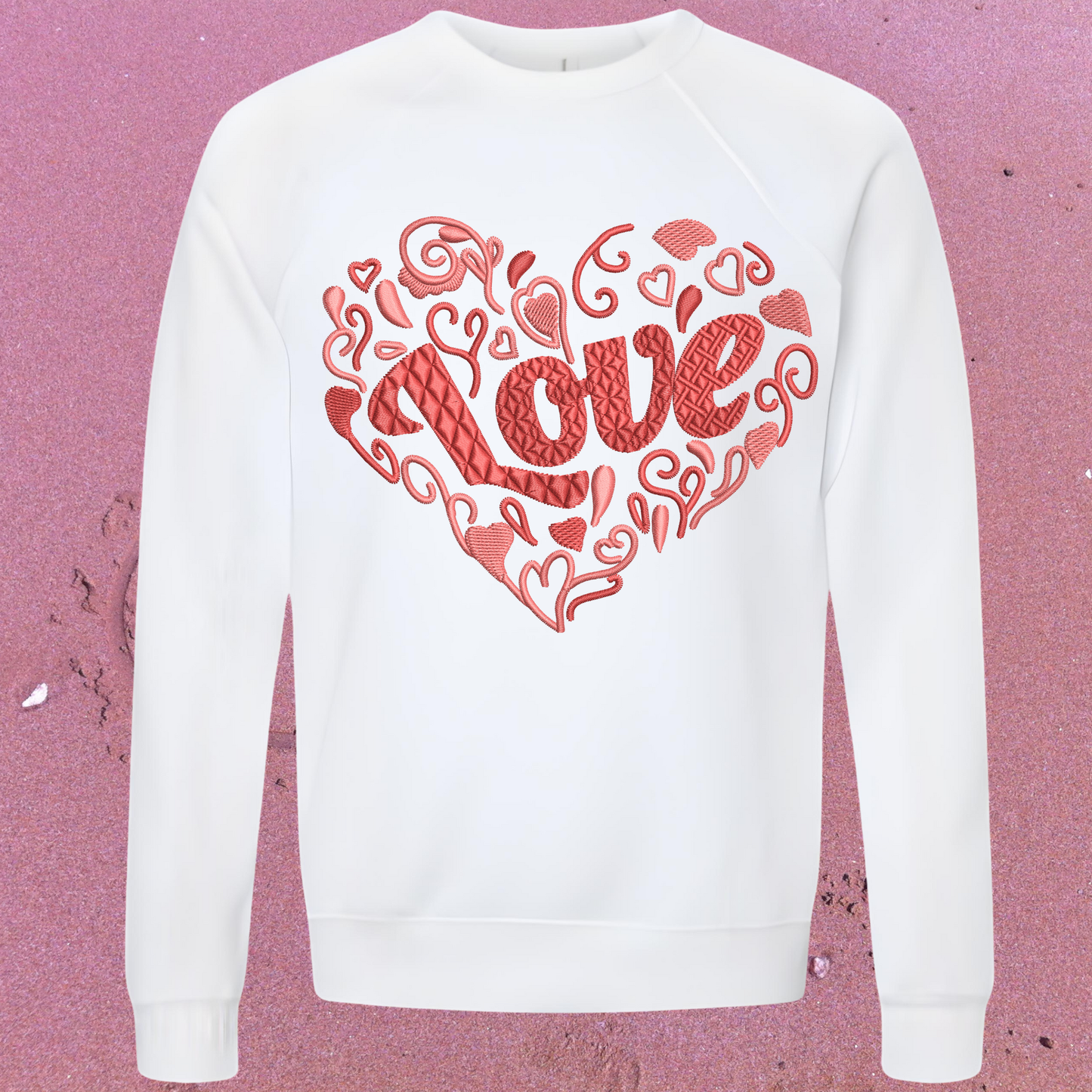 White sweatshirt with red 'LOVE' design on a pink textured background perfect for Valentines